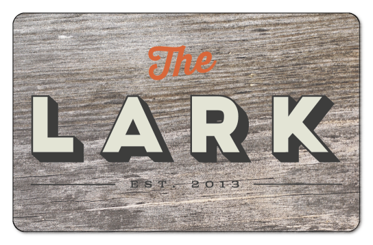 The Lark over wooden background
